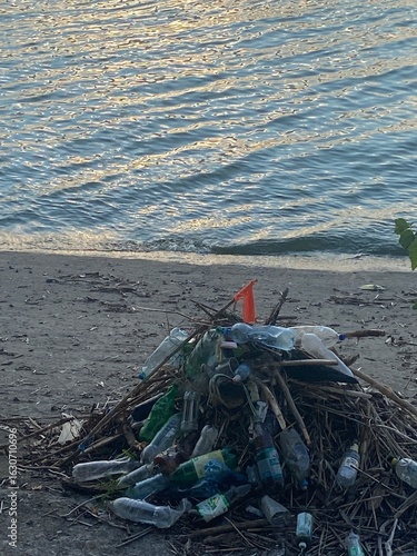 Wallpaper Mural Plastic Pollution on River Shoreline – Environmental Waste and Cleanup Awareness Photo Torontodigital.ca