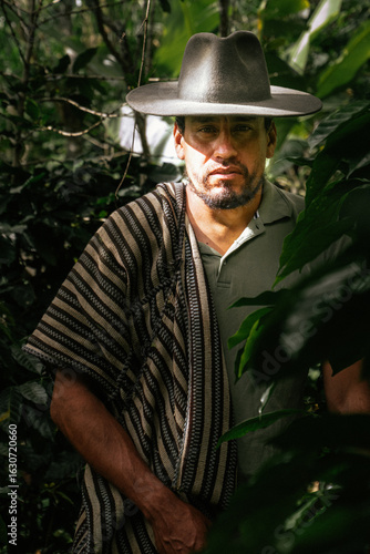 Male farmer harvesting on his coffee plantation