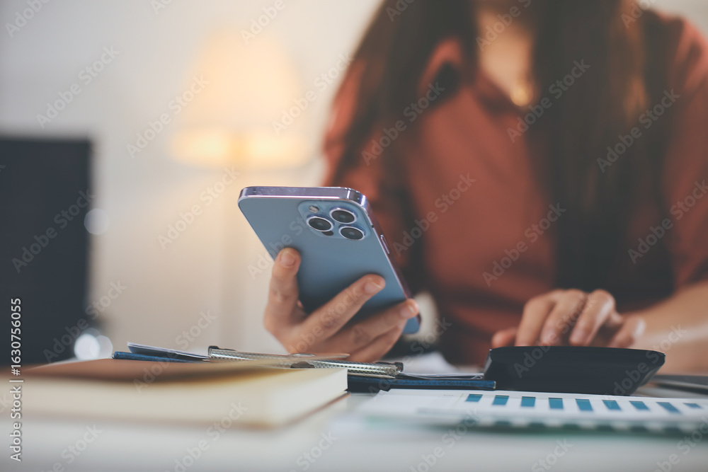 Fototapeta premium Portrait of young Hispanic professional business woman standing in office. Happy female company executive, smiling businesswoman entrepreneur corporate leader manager looking at camera using tablet