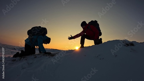 Go towards your goal. Travelers climb one after another on rock Climbers silhouettes stretch their hands to each other climbing to top of hill. Teamwork of business people. Team of businessmen victory