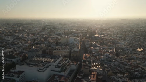 Aerial video of Seville at sunrise. Panoramic view, flying forwards.