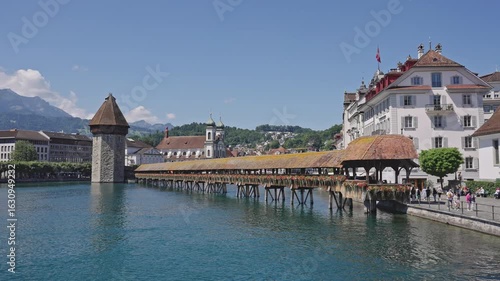 Chapel Bridge and Water Tower with Jesuit Church in Lucerne.Captured on July 15,2025.