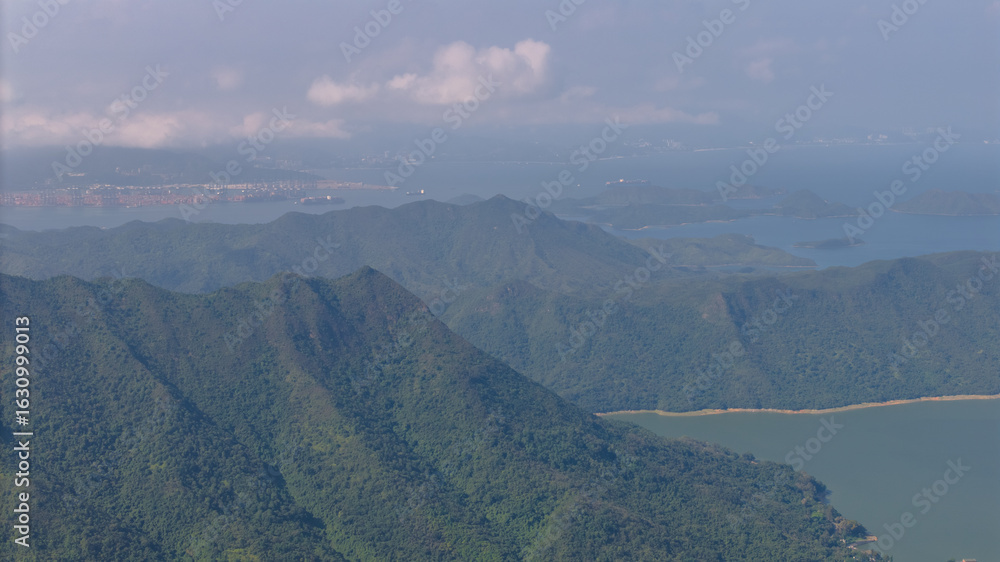 Fototapeta premium Scenic Mountain View with Cityscape and Cloudy Sky