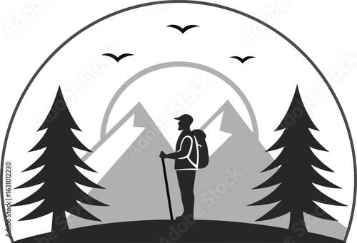 Silhouette of a hiker with backpack and trekking poles in a mountain landscape