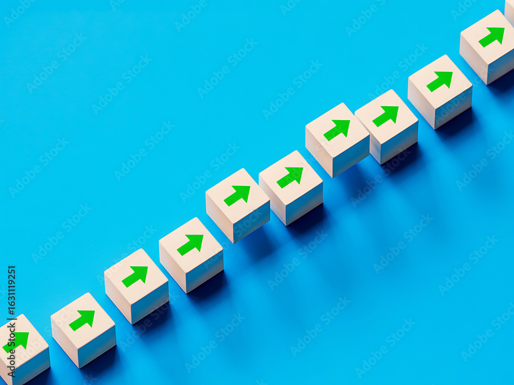 Obraz premium White cubes with green upward arrows arranged diagonally on a blue background