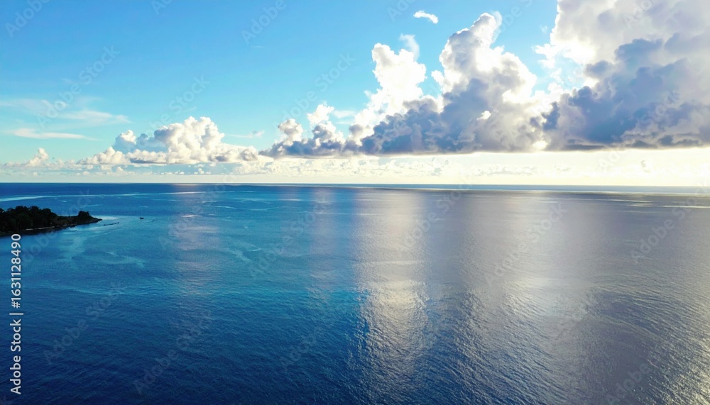 Fototapeta premium Calm weather on sea or ocean with clouds