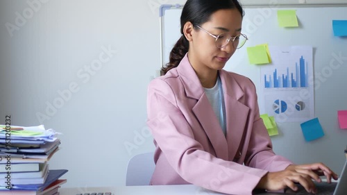 Young Asian woman feels numbness and severe pain in her wrist Caused by sitting and working for a long time Health care and office syndrome concept.