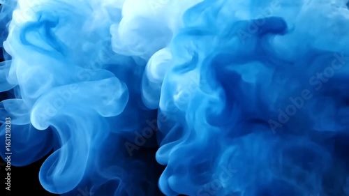Abstract blue ink drops in water video animation on black background