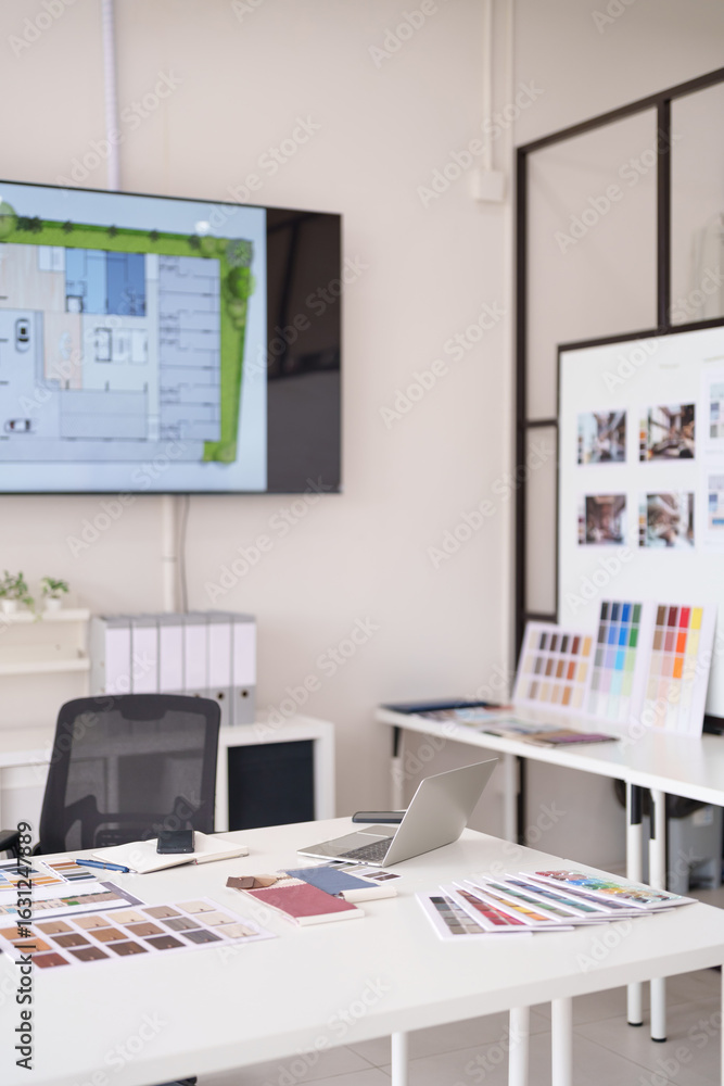 Fototapeta premium Architectural interior designer office workspace displaying floor plan on screen project planning creative design studio modern professional environment