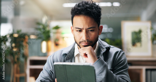 Tableau sur toile Thinking, tablet and business man reading email, report or article for journalism in office