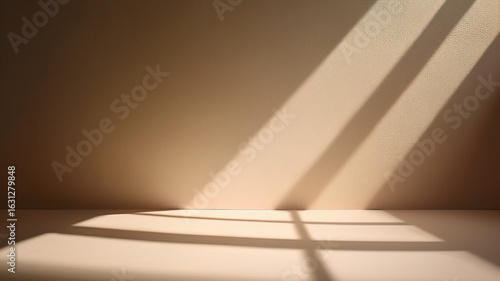 Sunlight creating palm leaf shadows on warm beige wall. Clean and cozy background.