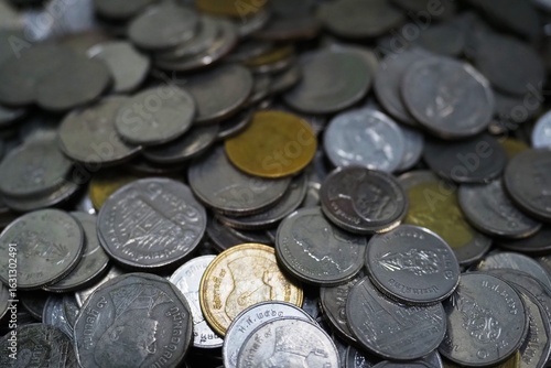 A pile of Thai baht coins mixed with Thai baht coins