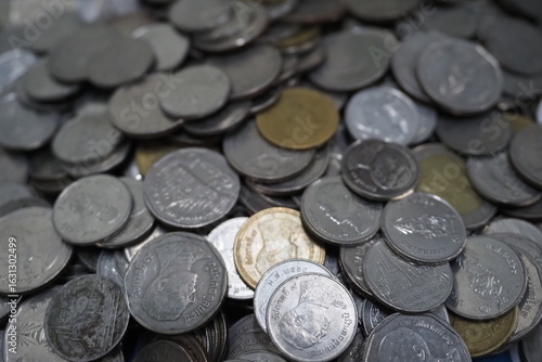 A pile of Thai baht coins mixed with Thai baht coins