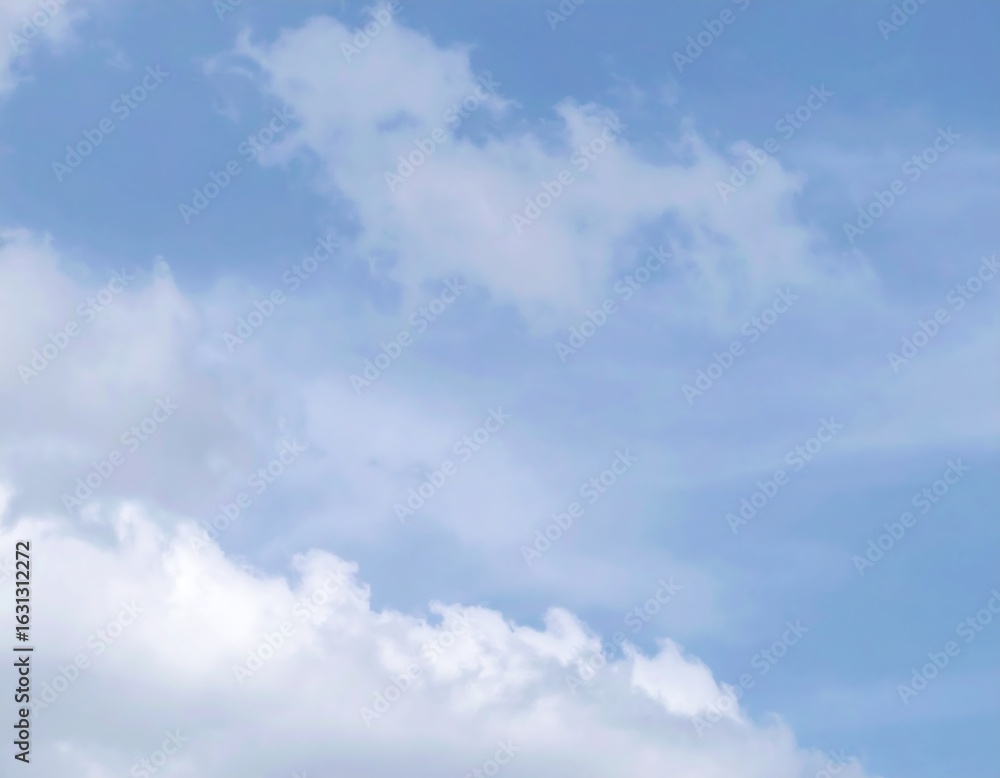 Blue sky with scattered fluffy white clouds Blue sky with scattered fluffy white clouds