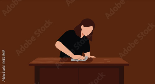 Woman wiping down a wooden table with a cloth in a dark room; cleaning use