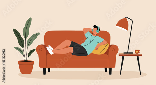 Person Relaxes on Couch Listening to Music, Plant & Lamp Beside for Lifestyle Use