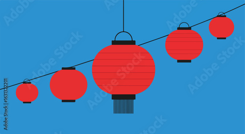 String of red lanterns hang against blue sky for a festive celebration