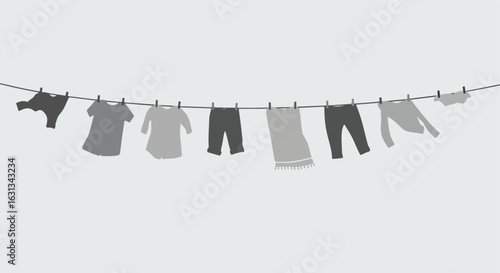 Clothes hung with clothespins on clothesline in white background for laundry use