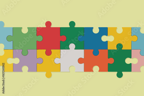 A close up shot of colorful puzzle pieces connected together on a light yellow colored background plane