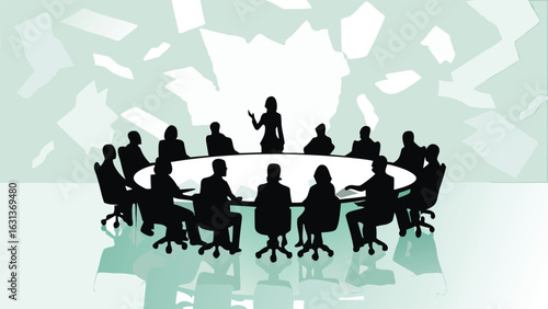 Silhouette of a woman presenting to a group of people around a round table in a meeting room