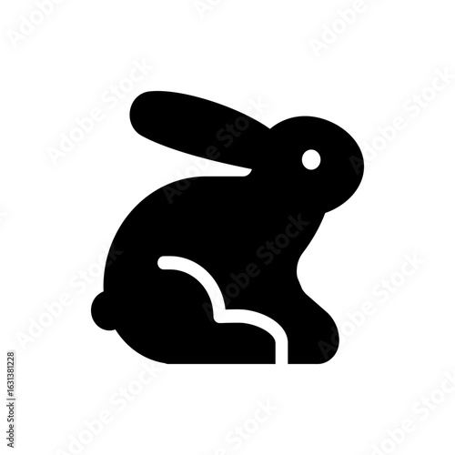 Silhouette of a rabbit with long ears and a short tail sitting down in a simple black and white design style