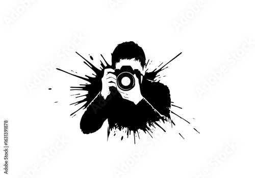Silhouette of a photographer holding a camera with ink splashes 