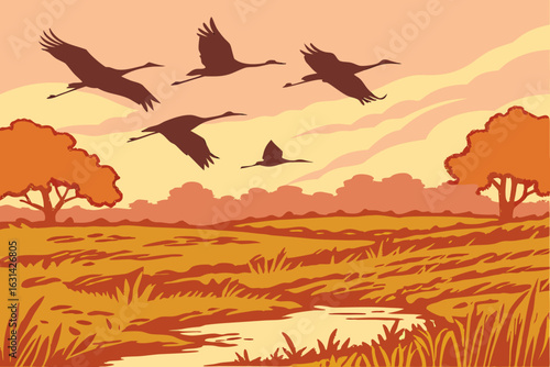 A flock of migrating sandhill cranes flying over central Illinois wetlands during a golden autumn sunrise.