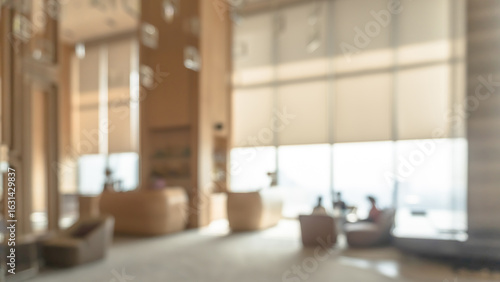 Blurred hotel or office building lobby blur background interior view toward reception hall, modern luxury white room space with blurry corridor and building glass wall window