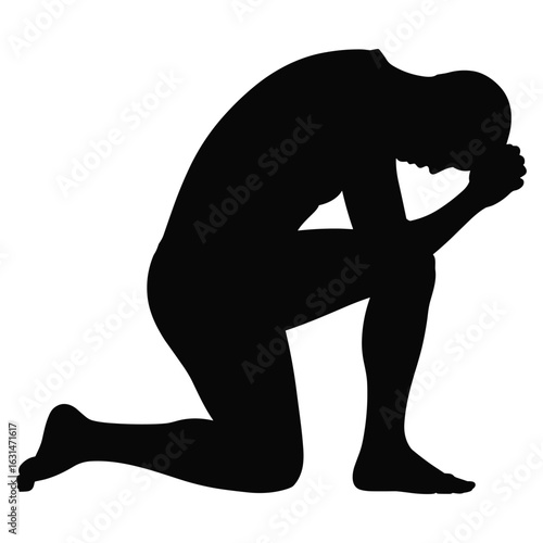 Man kneeling in prayer silhouette