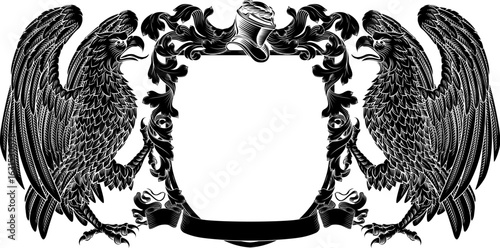 Eagles coat of arms or crest family heraldry medieval heraldic knight shield with helmet and acanthus filigree scroll ornament in a vintage woodcut style.