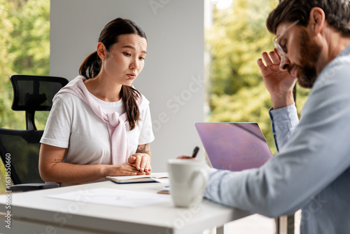 Fényképezés Stressed business people having a difficult conversation at work