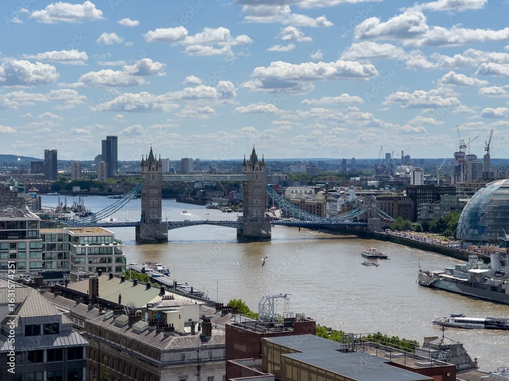 Obraz premium view of the city of london with tower bridge and thames river with boats