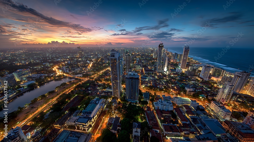 Fototapeta premium Cityscape at Twilight with Illuminated Buildings and Coastal View