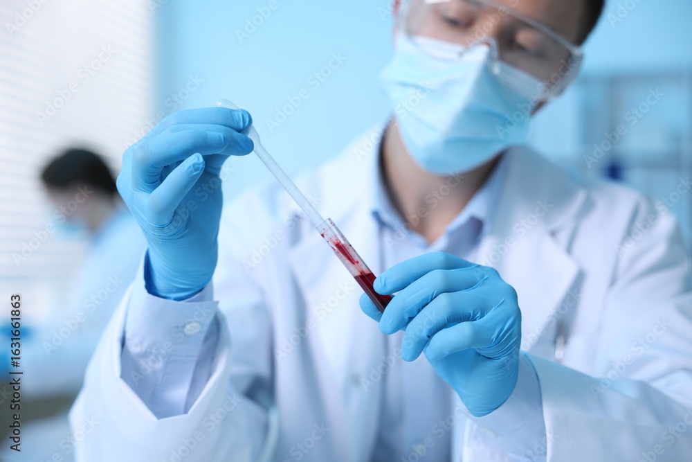 Medical analysis. Scientist working with blood sample in laboratory, selective focus Medical analysis. Scientist working with blood sample in laboratory, selective focus