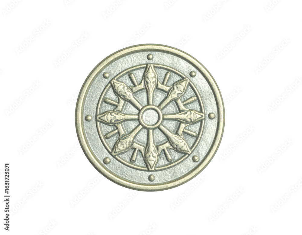 Fototapeta premium Embossed silvergold medallion with a textured surface featuring the eightspoked Buddhist Dharma Wheel.