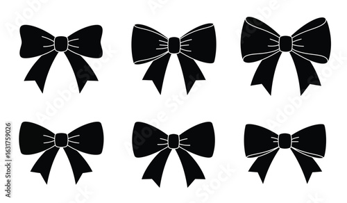 Collection of six classic black ribbon bows with elegant loops and flowing tails isolated on a white background