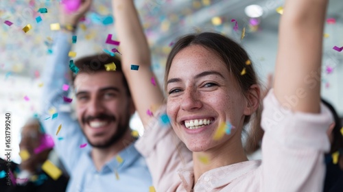 Joyous confetti shower over jubilant Caucasian man and woman at office celebration, embracing the quirky spirit of Fun at Work Day