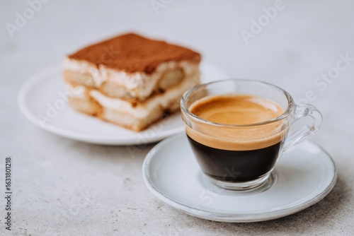 Elegant tiramisu tango with espresso's deep embrace, invoking Italian Dolce Vita and International Coffee Day's rich aroma
