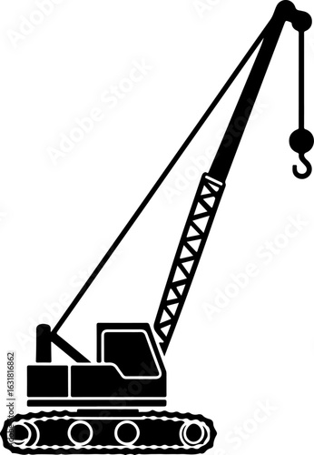 Construction crane lifting cargo at industrial site with clear blue sky silhouette
