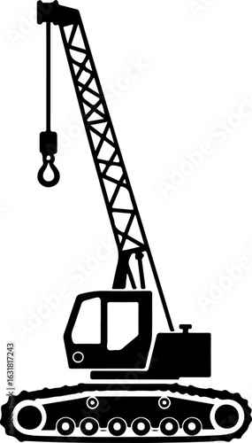 Construction crane lifting cargo at industrial site with clear blue sky silhouette