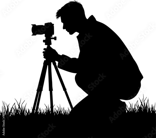 Silhouette of a Photographer with Camera on Tripod in Nature