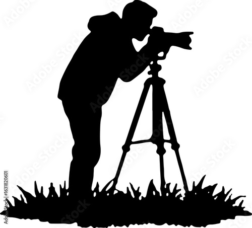 Silhouette of a Photographer with Camera on Tripod in Nature
