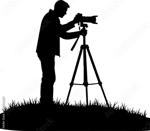 Silhouette of a Photographer with Camera on Tripod in Nature
