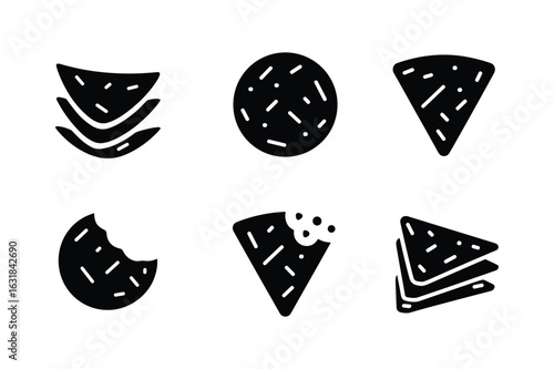Stacked triangular chips and round cookies with bite marks snacks food
