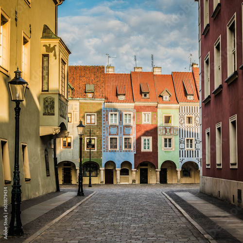 Colorful tenement houses in Poznań’s Old Town glow in the morning light — a quiet, charming corner perfect for a weekend travel