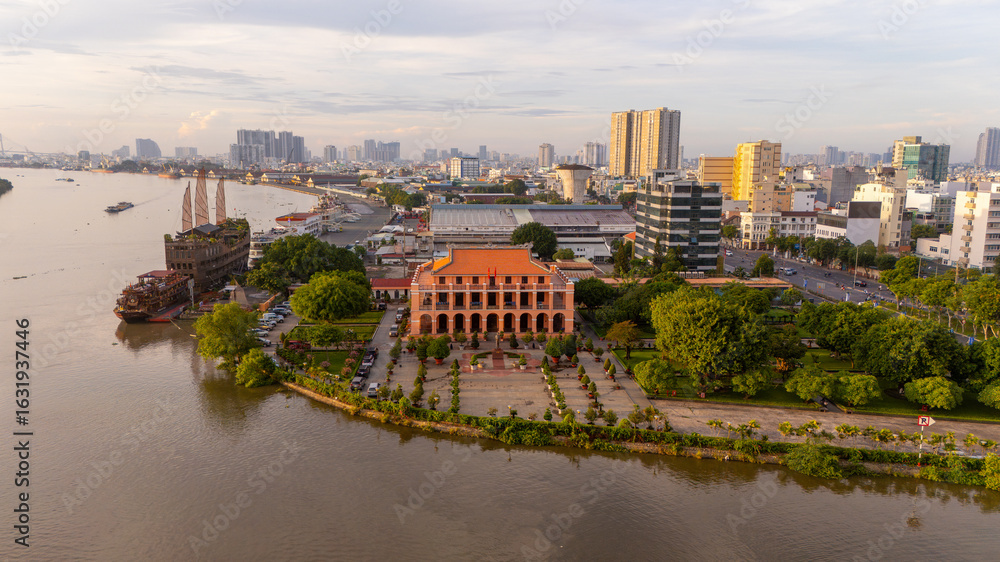 Fototapeta premium Aerial view of early morning at Nha Rong wharf and Bach Dang harbor in Ho Chi Minh City, Vietnam