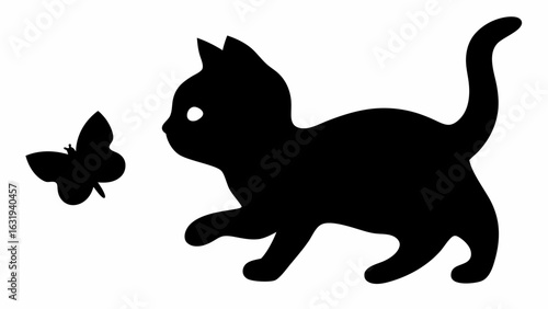 Silhouette of a playful kitten with its tail up chasing a butterfly isolated on a white background image