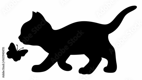 Silhouette of a kitten playing with a butterfly in a playful pose with its tail up and ears perked up