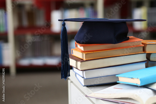 Students browsing a book in the library or bookshop, exam preparation, teacher training, higher education, e-learning for students, research project work for masters, bachelors, internships