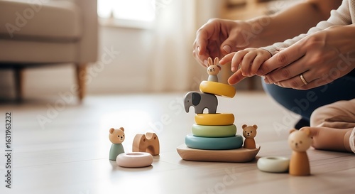 Photo of parent and child playing with a wooden stacking toy on the floor